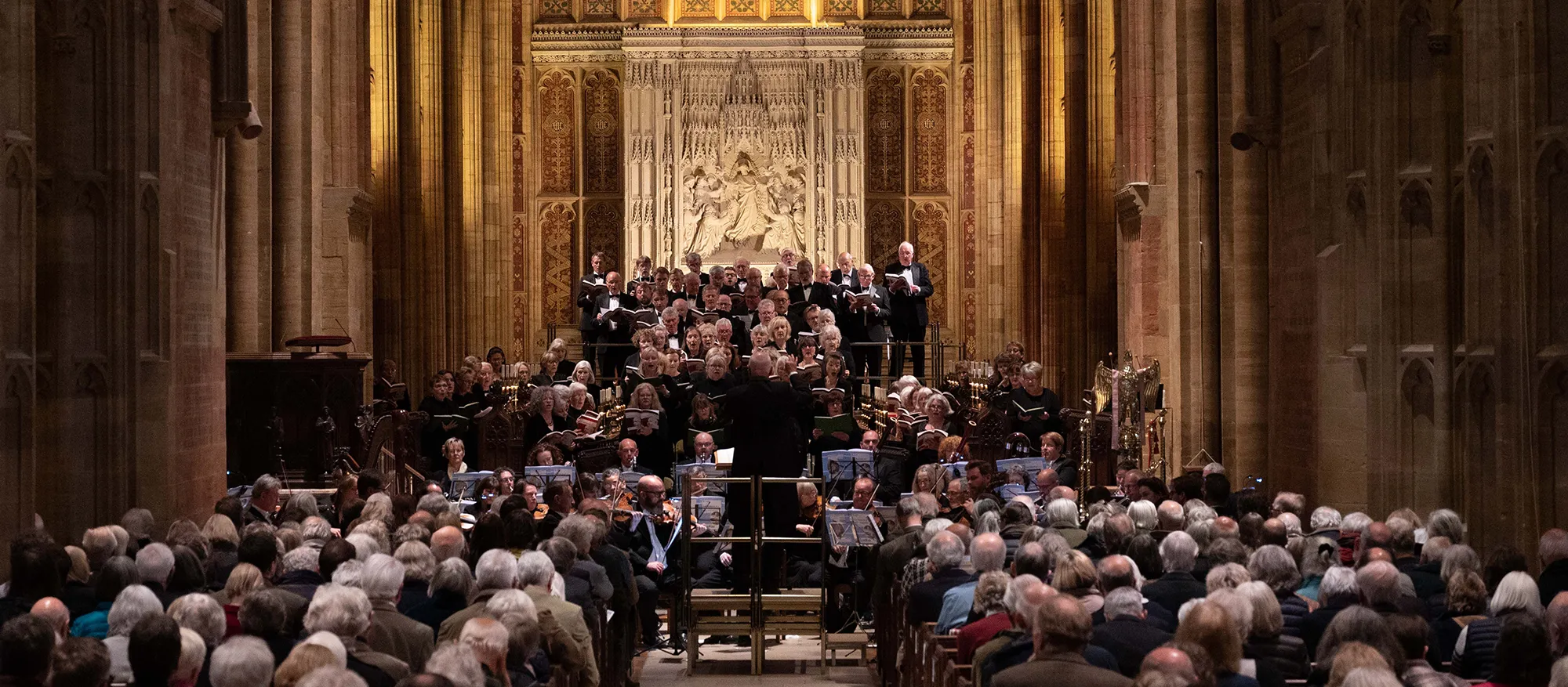Sherborne Festival Chorus performing in Sherborne Abbey, viewed from the nave